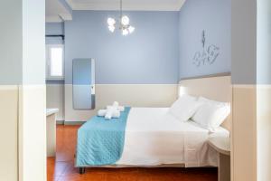 Un pat sau paturi într-o cameră la Hotel Grifo +133 fotografii