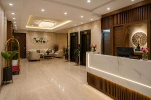 a lobby of a hotel with a reception desk at Hotel Luxury Inn Delhi Airport in New Delhi