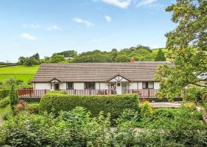 a large white house with a roof at Avalon Cottages in Llangynin +16 photos