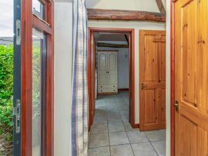 a hallway with two doors leading to a room at Thyme - E4485 in Catfield