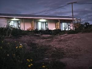 a house with windows on the side of it at Maphango Farms BnB in Alice