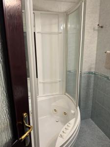 a bathroom with a shower with a tubuclearuclear at ХОТЕЛ ВИЛА Мая in Pleven +16 photos
