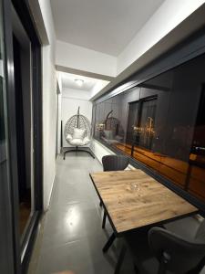 a dining room with a table and a chair at suite palace in Kapullu