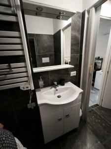 a bathroom with a white sink and a mirror at Due Orizzonti in Monsampolo del Tronto +38 photos