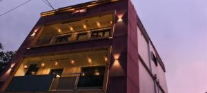 a building with lights on the side of it at COCHIN CINEMA Rooms in Cochin
