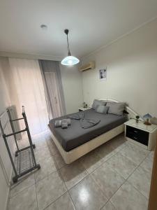 a bedroom with a large bed and a table at Velinora House in Rafina