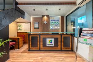 a lobby with a sign that reads its always a good day at mecca at Treebo Planet Mount Near US Consulate Anna Salai in Chennai