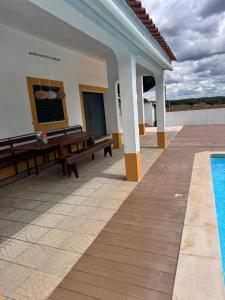 a villa with a swimming pool and a house at Monte Santo in Montargil