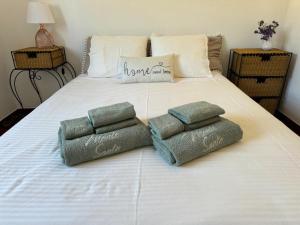 a white bed with towels on top of it at Monte Santo in Montargil +46 photos
