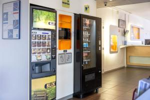 a cell phone vending machine in a store at ibis budget Narbonne Sud A9/A61 in Narbonne