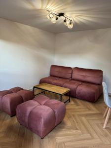 a living room with a couch and a table at Hi Wisła in Wisła