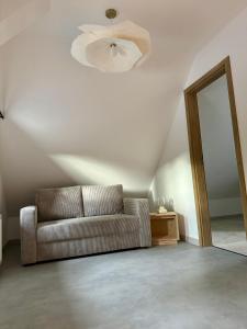 a living room with a couch and a mirror at Hi Wisła in Wisła