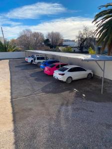 a row of cars parked in a parking lot at Departamento Centro Viedma in Viedma