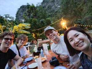 a group of people sitting at a table at Haven Kitchen & Cafe in Nguyễn Thôn