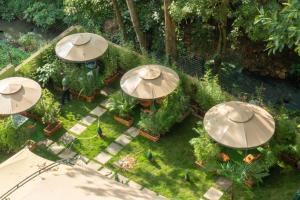 an overhead view of a garden with umbrellas at GRANADA HOTEL NAIROBi in Nairobi