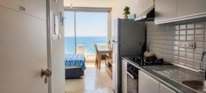 a small kitchen with a view of the ocean at Healthy Apartments Abelia Residence in Iskele