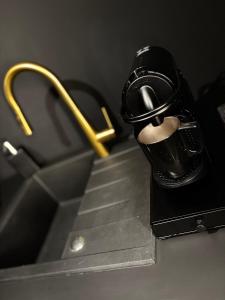 a close up of a bathroom sink with a faucet at House-Evasion in Tuchan +9 photos