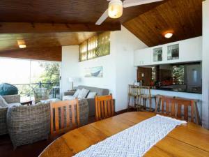 a kitchen and living room with a table and chairs at 8 Hewitt @ Tiffany's in Sheffield Beach