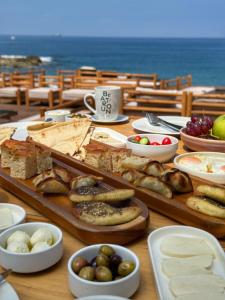 a table topped with different types of food at Be Batroun in Batroûn