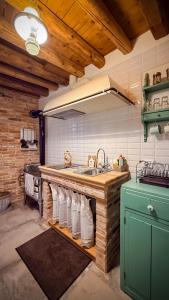 a kitchen with a sink and a counter with towels at B&b ANTICO MAGLIO in Asolo +110 photos