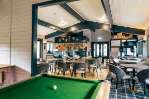 a billiard room with a pool table and a bar at Stratheck Holiday Park in Dunoon