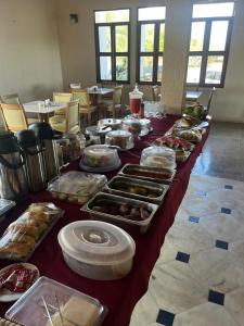 a long table filled with different types of food at Hotel Costa do Sol in Conde