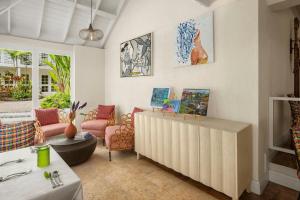 a living room with a couch and a table at Treasure Beach Art Hotel, An Autograph Collection All-Inclusive Resort in Saint James