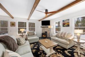 a living room with white furniture and a fireplace at Luxury Retreat, Views, Near Whiteface, Lake Placid in Jay +81 photos