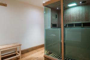 a green refrigerator in a room with a table at Serenity in Painswick +28 photos