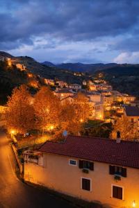 a view of a town at night with lights at Gold House in Lungro