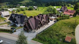 an overhead view of a large house in a village at Czarna Turnia -ZAKOPANE in Zakopane