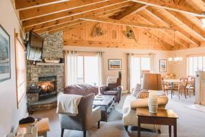 a living room with a couch and a fireplace at Mountain Home, Views, Near Whiteface, Lake Placid in Wilmington