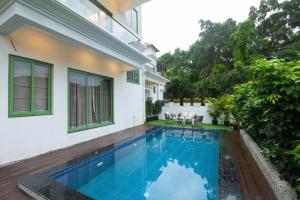 a swimming pool in the backyard of a house at Luxury 3BHK Villa with Private Pool & PS5 in North in Socorro