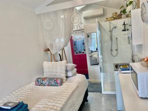 a small room with a sink and a shower at Studio 59 Newport sleeps1 in Newport
