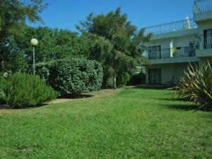 a yard in front of a apartment building at Bayside Salgados in Albufeira