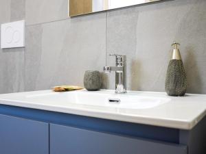 a bathroom with a white sink and a mirror at La Martina Guesthouse in Angri