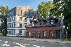 a building on the side of a street at Homly S22 in Riga