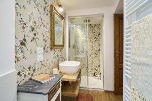 a bathroom with a sink and a shower at CasaBianchini Charming Home Val d'Orcia in Monticchiello +52 photos