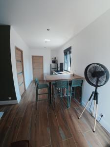 a kitchen and dining room with a table and chairs at Cosy et Calme in Cholet