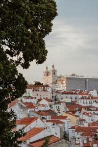 a view of a city with red roofs at Memmo Alfama - Design Hotels in Lisbon