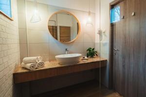a bathroom with a sink and a mirror at Amethyst in Sovata +96 photos