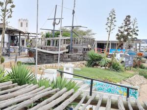 a view of a playground with a slide at Saint Anna Beach House in St. Helena Bay