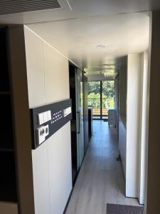 a hallway of an office building with a counter top at Capsule house for rent at Gut Holtmann in Billerbeck