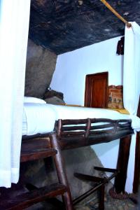 a bunk bed in a room with a ladder at Giripura Resort - Kandy in Kandy