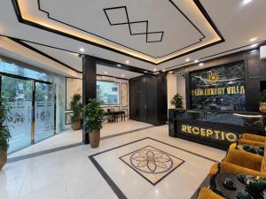 a living room with a couch and a table at Vera Luxury Hotel in Hanoi