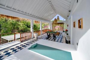 a house with a pool table on a deck at 2BR, Private Pool, Prime Location, Tropikarma in Toyapakeh