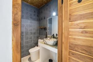 a bathroom with a sink and a toilet at 2BR, Private Pool, Prime Location, Tropikarma in Toyapakeh +10 photos