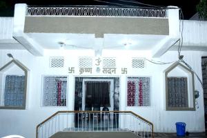 a white building with a staircase in front of it at Shukla home stay in Jabalpur +4 photos