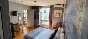 a bedroom with a bed with a map on the wall at Le Pavillon Hotel in Paris