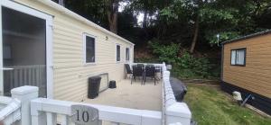 a patio with a table and chairs on a house at Heatherview Willerby in Bishop Auckland
